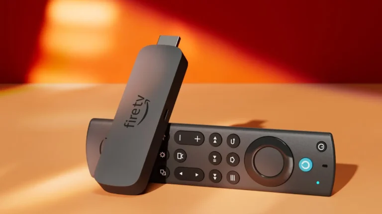 Amazon Fire Stick 4K streaming stick with remote on a wooden table.