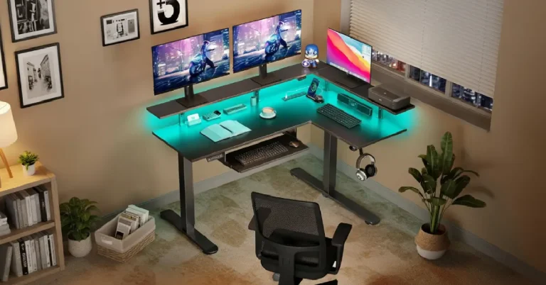 Rolanstar L shaped standing desk in dual monitor remote work setup with RGB lights, keyboard tray, and ergonomic chair - perfect for hybrid productivity.